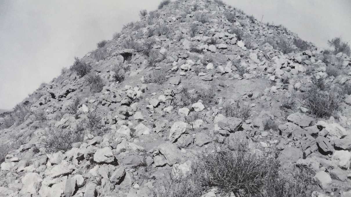 Black and white photo of pueblo ruins before reconstruction