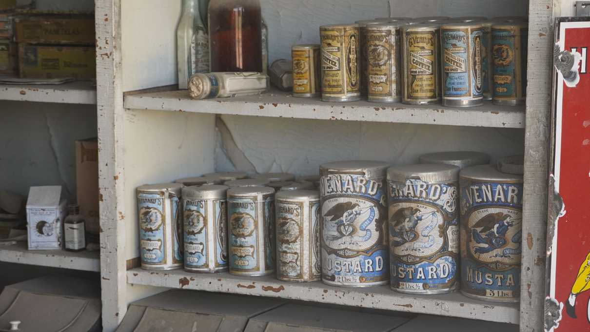 Shelves of old food canisters in mercantile store